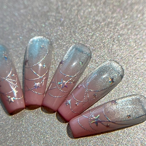 Pink and blue gradient star nail stickers with silver chain details and laser shimmer