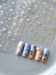 Detail of YT5144 summer nail stickers with gold palm trees and seagulls on grey tray