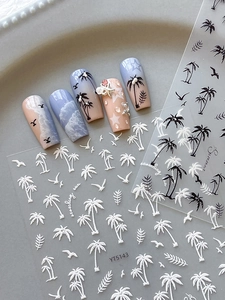 Close-up of 3D embossed beach stickers with coconut trees and seagulls for nail art