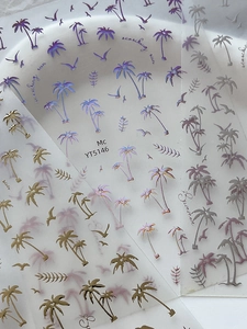 Macro shot of YT5146 summer nail stickers featuring gold tropical palm trees and birds