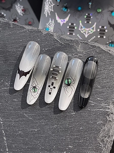 Detailed gothic press-on nails with 3D spiders and cat-eye gradient on black stone