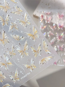 Macro shot of iridescent butterfly nail art stickers with holographic finish YT5437Tm