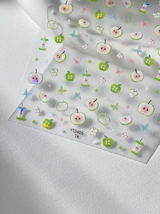 Macro detail of YT5405 green apple nail stickers with glitter butterflies and stars