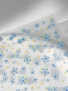 Detailed macro view of blue five-petal flower nail stickers on transparent PET film