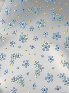 Macro detail of elegant blue five-petal flower nail stickers with floral patterns