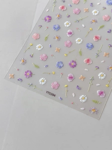 Macro detail of YT5394 embossed floral nail art stickers with pink and purple daisies