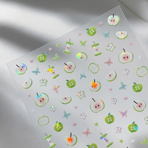 Cute green apple nail art stickers with holographic stars and butterflies on transparent film