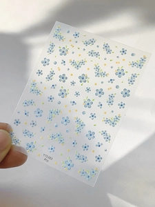 Detailed view of YT5383 Pro nail art stickers featuring blue and yellow floral patterns