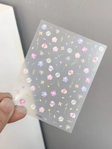 Detailed close-up of YT5394 embossed floral nail art stickers with colorful daisies