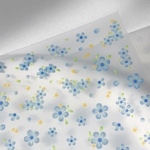 Minimalist blue floral nail art stickers with five-petal flowers and green leaves