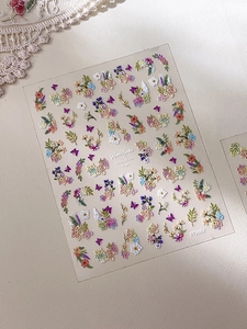 Macro view of Monet's Garden floral nail stickers with colorful 3D embossed flowers