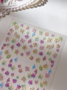 Macro detail of embossed oil painting flower nail stickers with relief texture