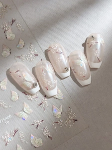 Macro detail of YT5486 shell butterfly flower nail stickers and 5-piece press-on nails