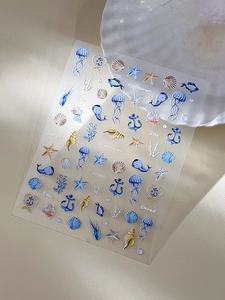 Détail d'autocollants gaufrés pour ongles thème océan avec méduses et coraux colorés