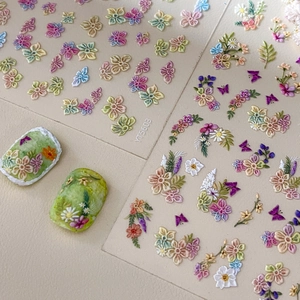 5D embossed Monet garden nail stickers with colorful flowers and butterflies on green nails