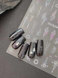 Macro view of cyberpunk nail stickers with silver laser circuit board and chip designs