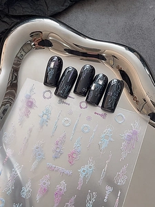Macro shot of cyberpunk nail stickers with laser circuit patterns and futuristic details