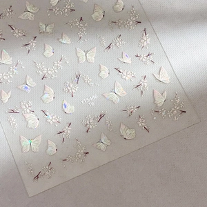 Self-adhesive nail art stickers with iridescent 3D butterfly and floral shell designs