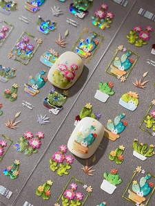 Detailed holographic cactus nail stickers with 3D embossed floral patterns and gold lines