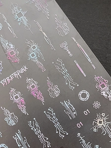 Detailed view of cyberpunk nail stickers with circuit board patterns and neon gradients