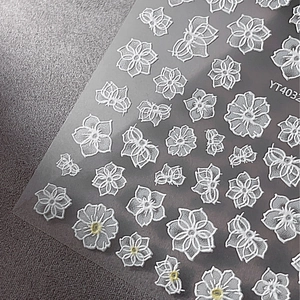 3D white embossed flower and butterfly nail art stickers on a transparent sheet YT4032
