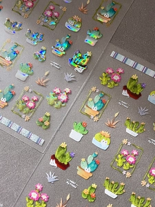 Close-up of succulent and cactus nail stickers with colorful laser reflective finish