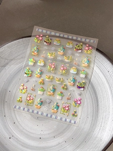 Macro detail of laser cactus nail art stickers with 3D metallic glitter effects