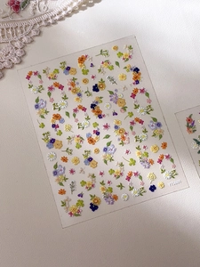 3D embossed floral nail stickers featuring colorful garden daisy and sunflower patterns