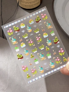 Detail shot of colorful cactus nail art stickers YT5475 on a transparent background sheet