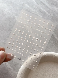 Silver metallic cross nail stickers YT5214 set shown on transparent backing sheet
