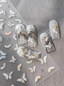Macro detail of iridescent butterfly nail stickers with laser holographic finish effects