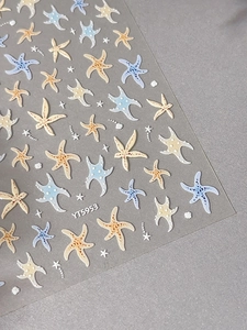 Detail of embossed starfish nail art stickers with blue and beige patterns, model YT5953