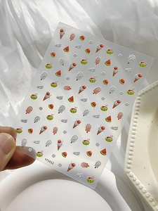 Detail of 5D embossed nail stickers featuring ice cream and watermelon summer patterns
