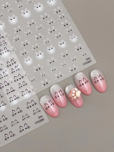 Detail of cute cat nail stickers with pink gradient nails and 3D cat paw art