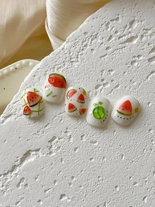 Detail of summer watermelon nail art stickers with green plaid and hand-drawn patterns