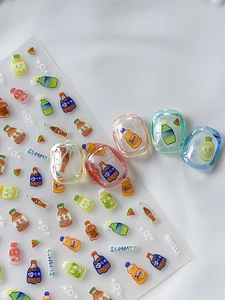 Detailed view of Summer Soda and Juice embossed 3D nail art stickers on clear resin nails