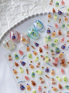 Detail of 3D embossed summer beverage nail art stickers with soda bottles and watermelon