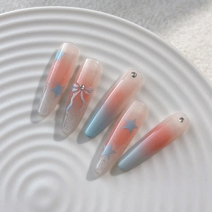 Pink and blue gradient press-on nails with 3D bows, stars and sparkling rhinestones