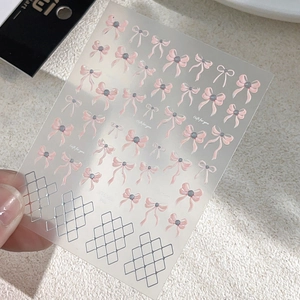 Pink bow nail stickers with silver diamond patterns and sweet minimalist ribbon designs