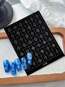 Detail of YT 98 nail art stickers featuring silver stars on blue gradient nails