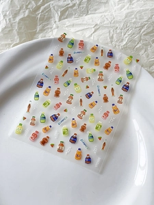 Detail of cute summer beverage nail art stickers with 3D embossed soda and fruit designs