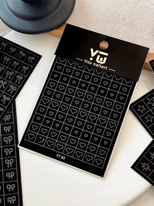Detail of YT93 nail art stickers featuring minimalist heart and bow line patterns