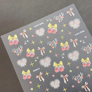 3D embossed nail stickers featuring pink cherry bows, hearts and stars on a grey background