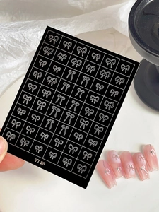 Detail view of YT 95 bow nail art stickers showing pink gradient nails with tiny rhinestones