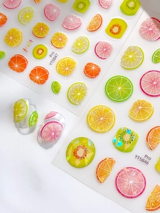 Detailed summer fruit nail stickers featuring lemon, lime, and orange slices for nail art