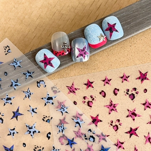 Punk style nail art stickers featuring leopard print stars and spots in blue and pink