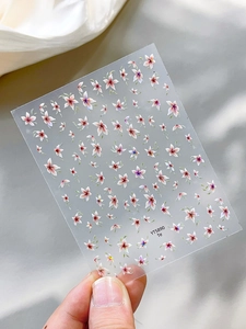 Macro detail of YT5890 floral nail stickers featuring pink and white cherry blossoms