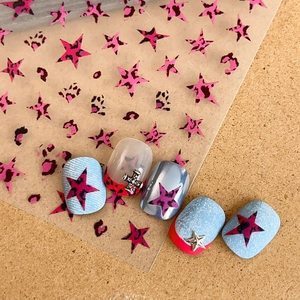 Y2K leopard star press-on nails with denim texture and 3D metal cross charms