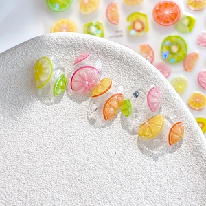 Summer fruit nail art stickers with realistic lemon and orange slices on clear base