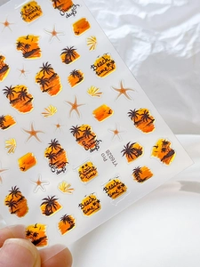 Detailed macro of sunset beach nail stickers with palm trees and summer text patterns